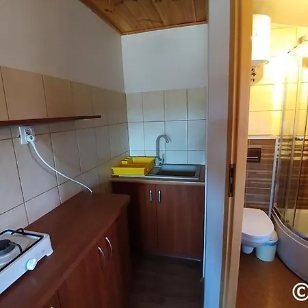 Uroczy Zakatek بيت خشبي